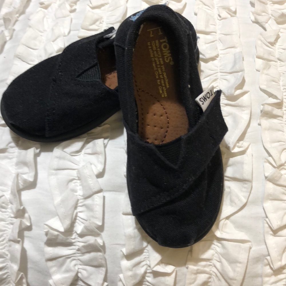 Toms all black canvas slip ons Size 7